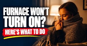 Woman wrapped in a blanket in a cold living room with the text Furnace Won't Turn On? Here's What to Do